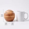 Home fragrance diffuser size comparison, 11cm tall next to a coffee mug
