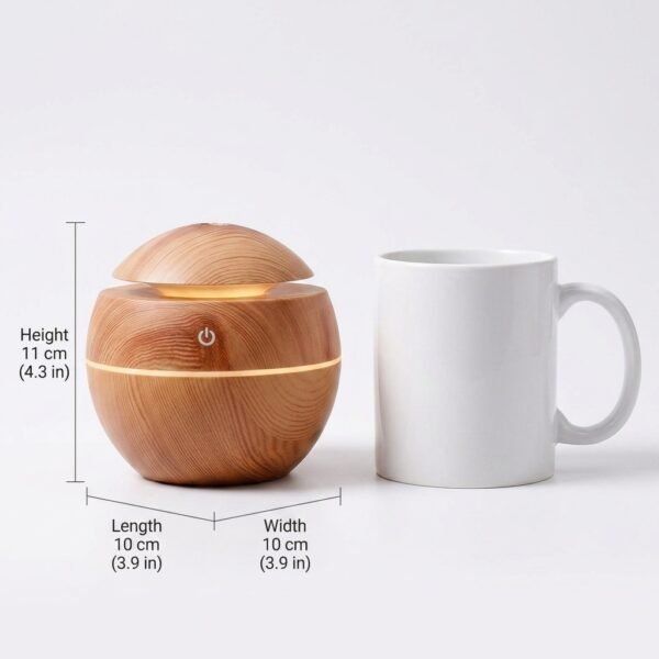 Home fragrance diffuser size comparison, 11cm tall next to a coffee mug